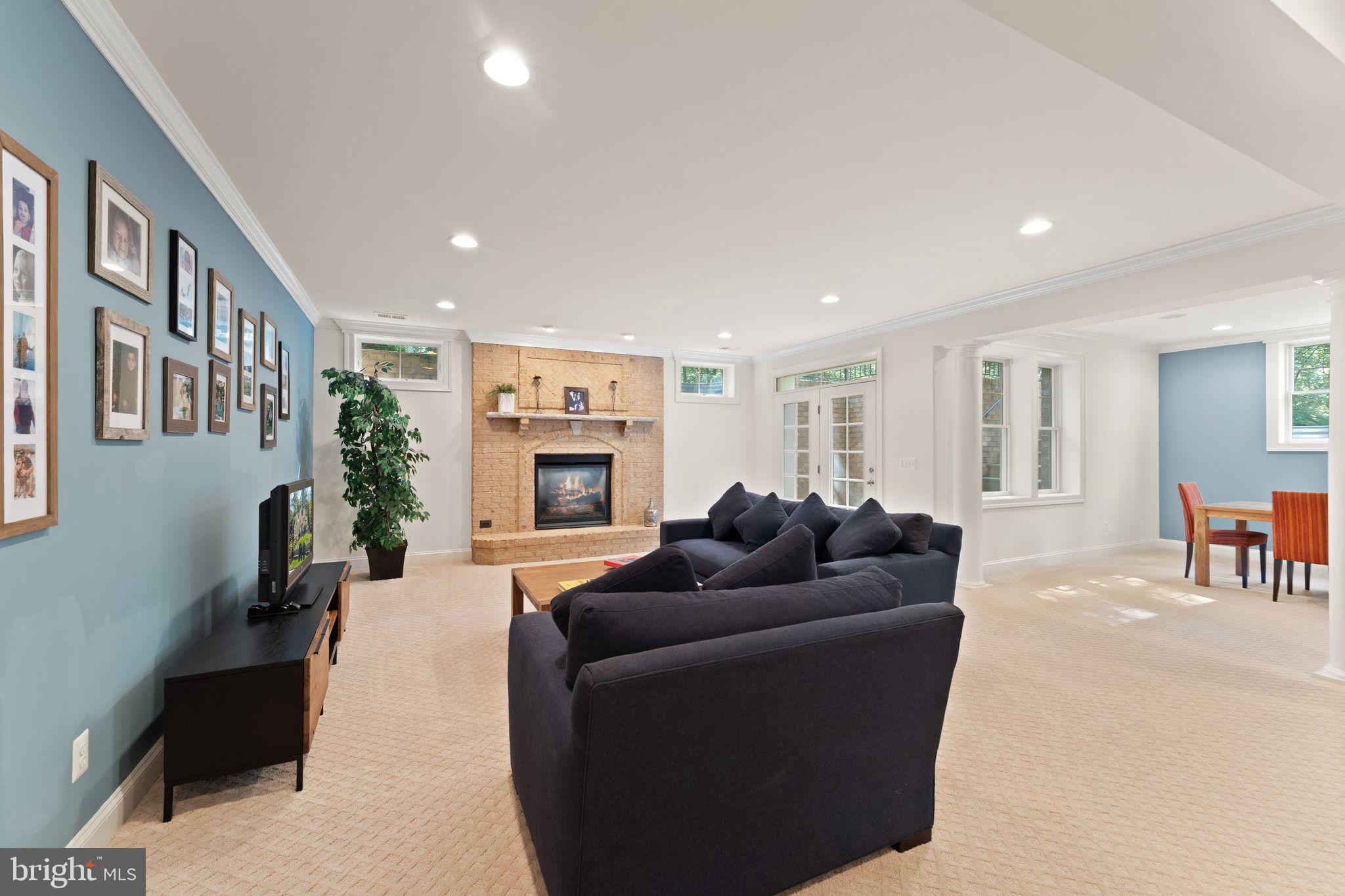 9603 Thistle Ridge Lane Vienna, VA 22182 - Photo 53 of 73 a living room with furniture and a wooden floor