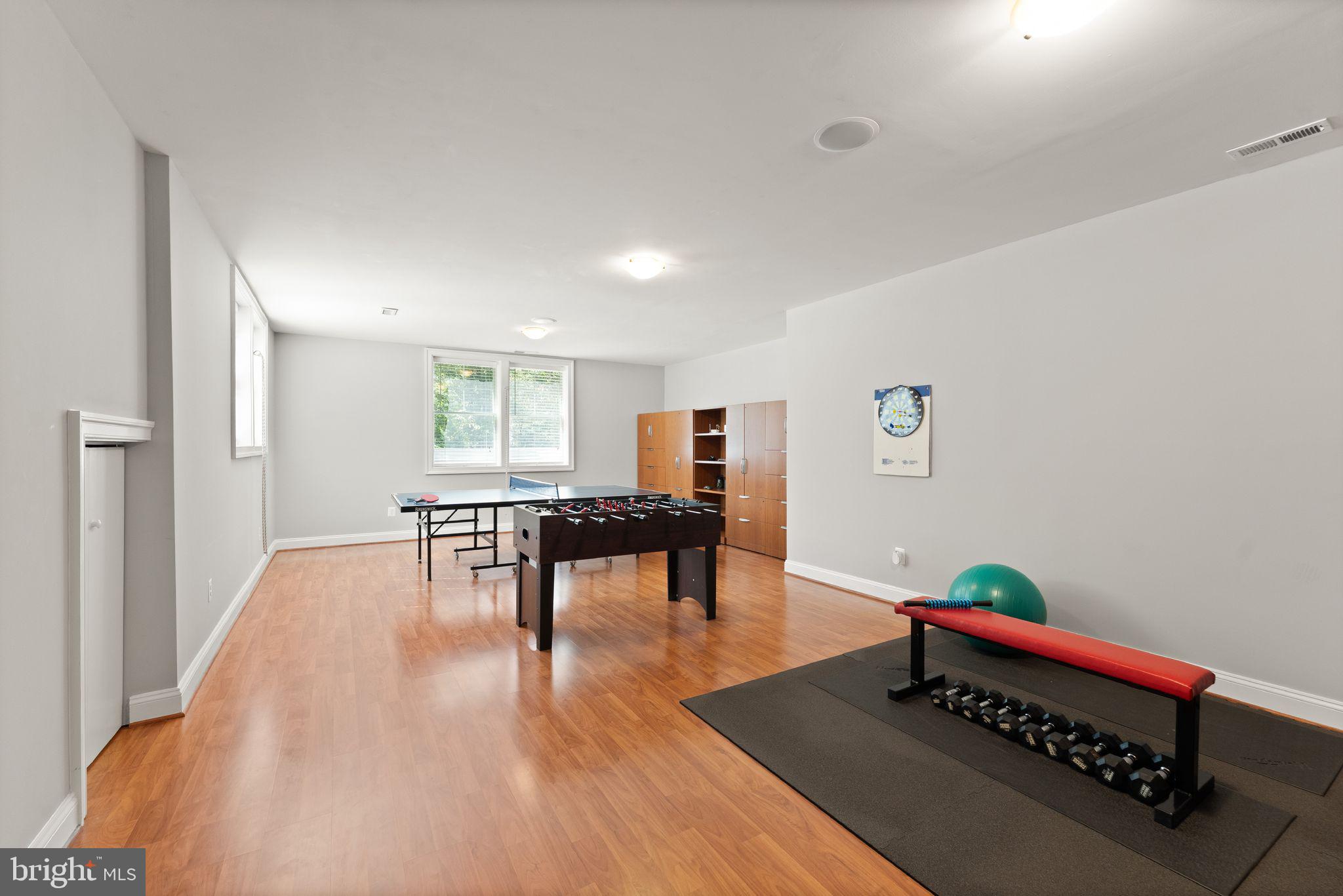 9603 Thistle Ridge Lane Vienna, VA 22182 - Photo 57 of 73 a living room with furniture and a table