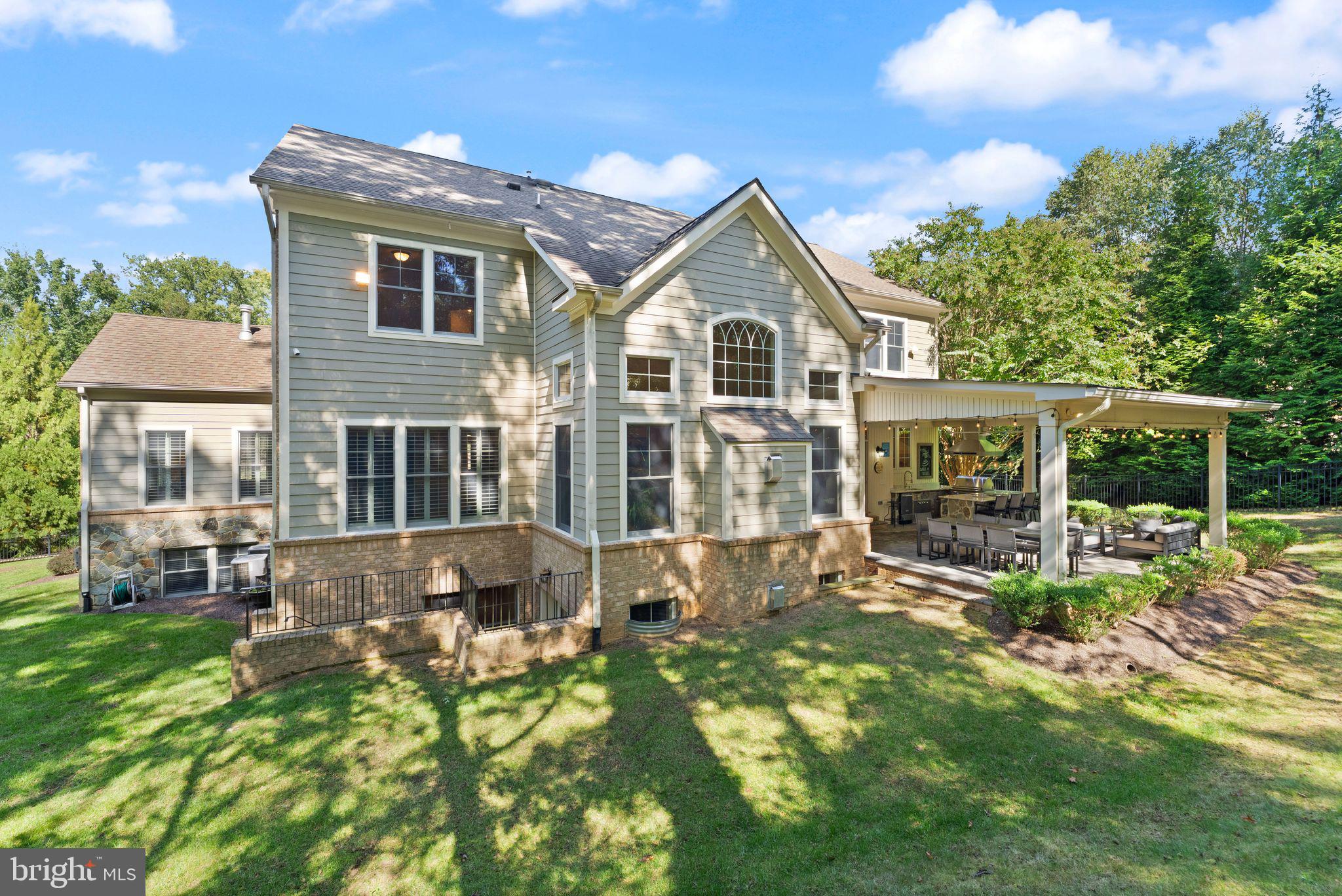 9603 Thistle Ridge Lane Vienna, VA 22182 - Photo 65 of 73 a front view of house with yard and green space