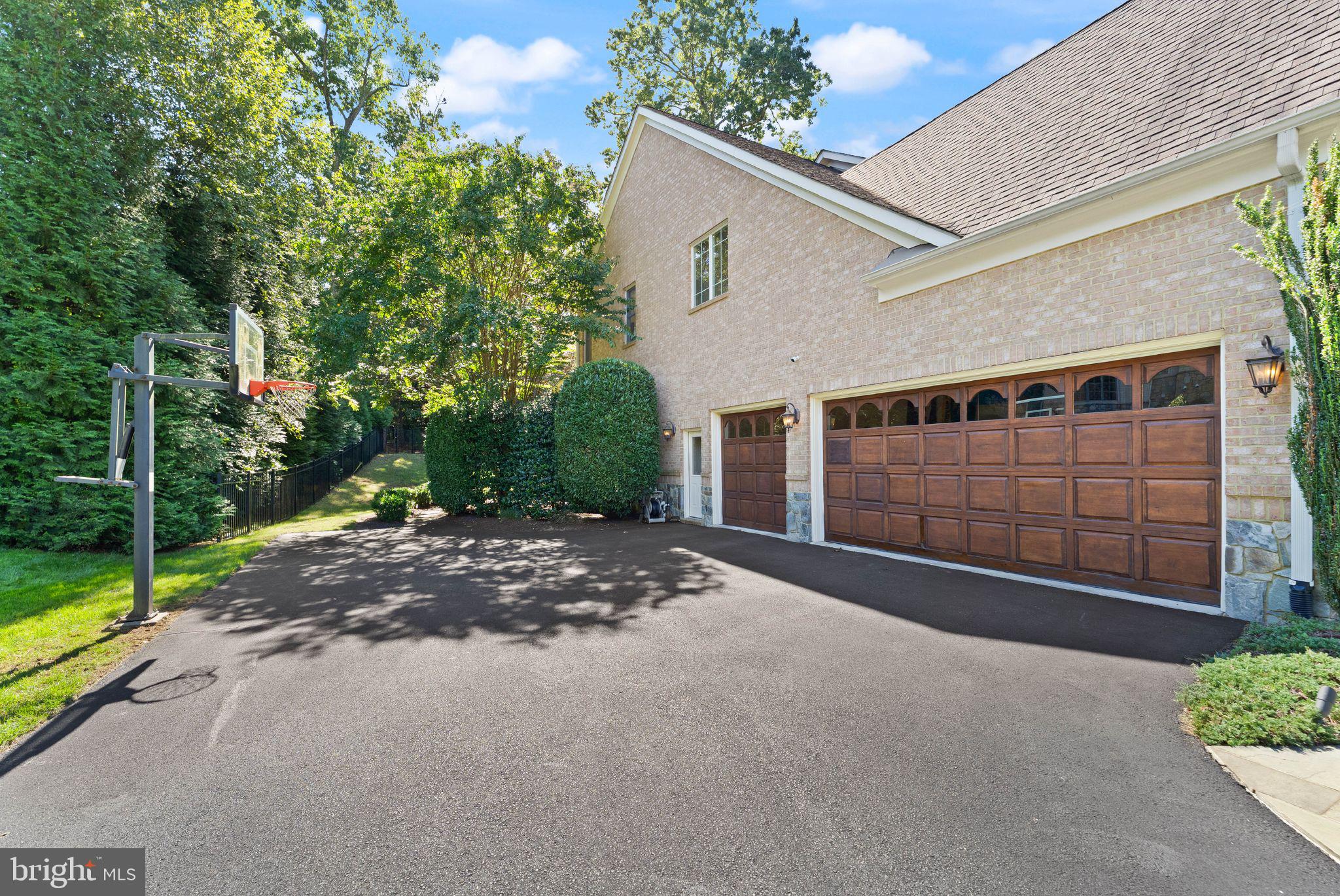 9603 Thistle Ridge Lane Vienna, VA 22182 - Photo 68 of 73 a view of a house with backyard and garage