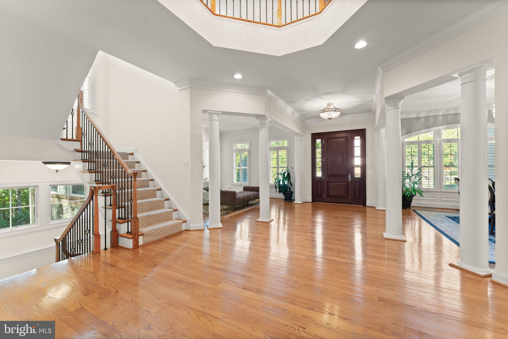 9603 Thistle Ridge Lane Vienna, VA 22182 - Photo 8 of 73 a view of an entryway with wooden floor and a livingroom