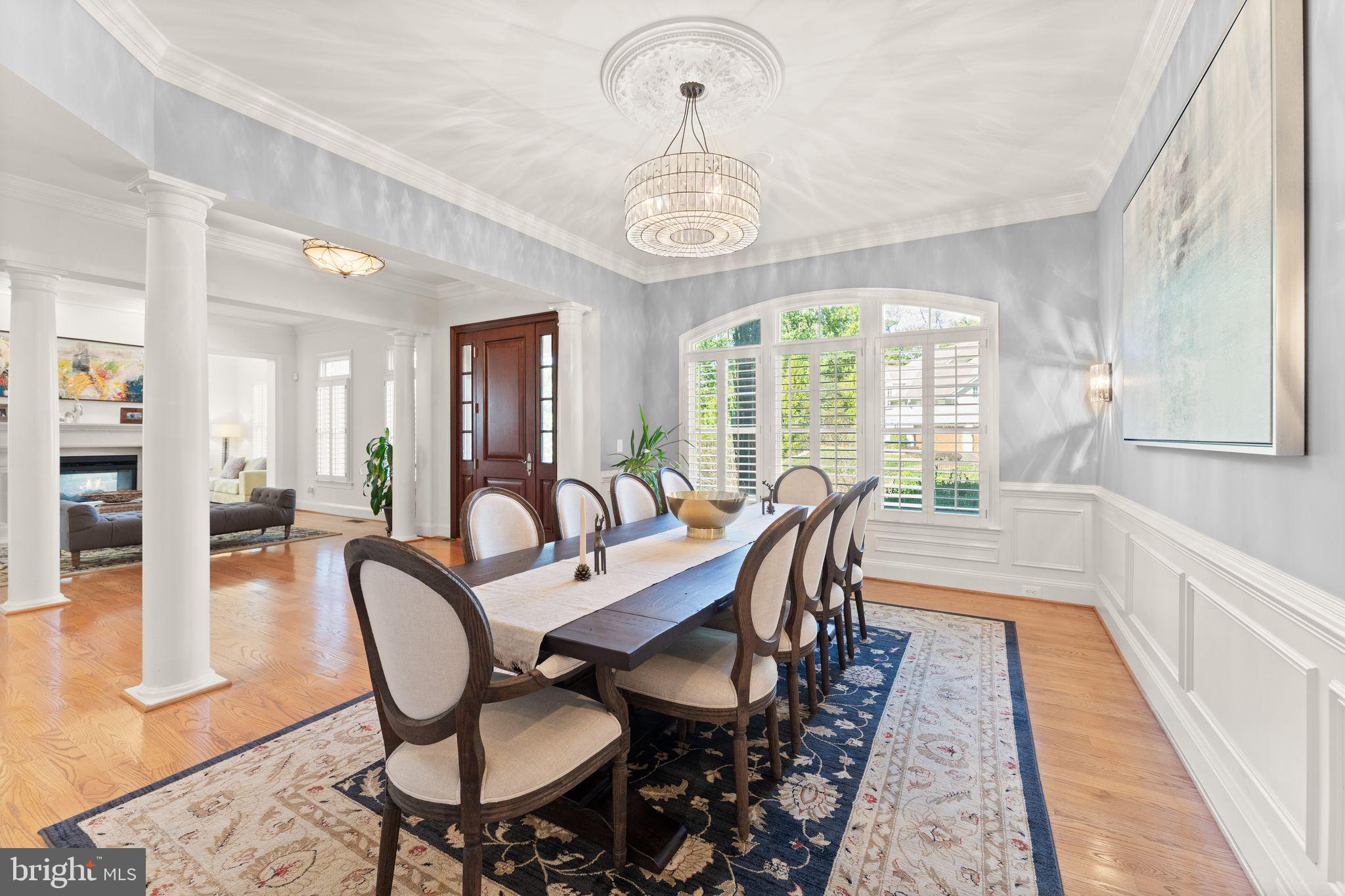 9603 Thistle Ridge Lane Vienna, VA 22182 - Photo 10 of 73 a view of a dining room with furniture window and wooden floor
