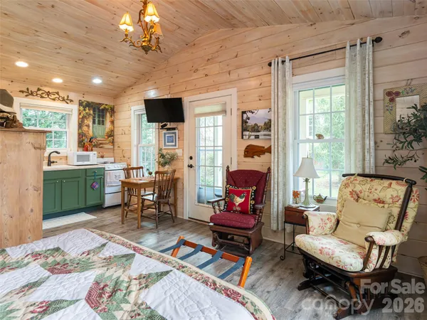 a bedroom with a bed and a table in it