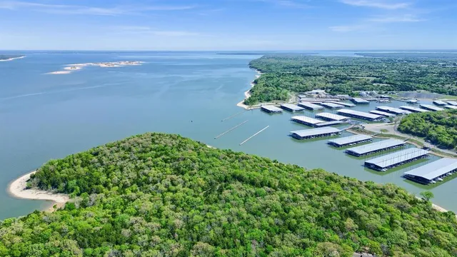 an aerial view of a house with a lake view