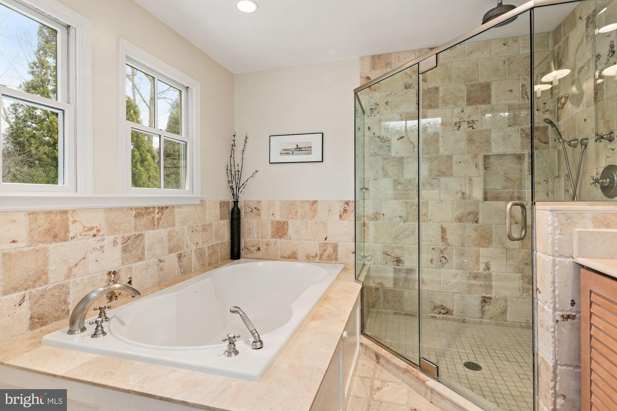 5821 Plainview Road Bethesda, MD 20817 - Photo 20 of 46 Primary bath has glass shower and soaking tub