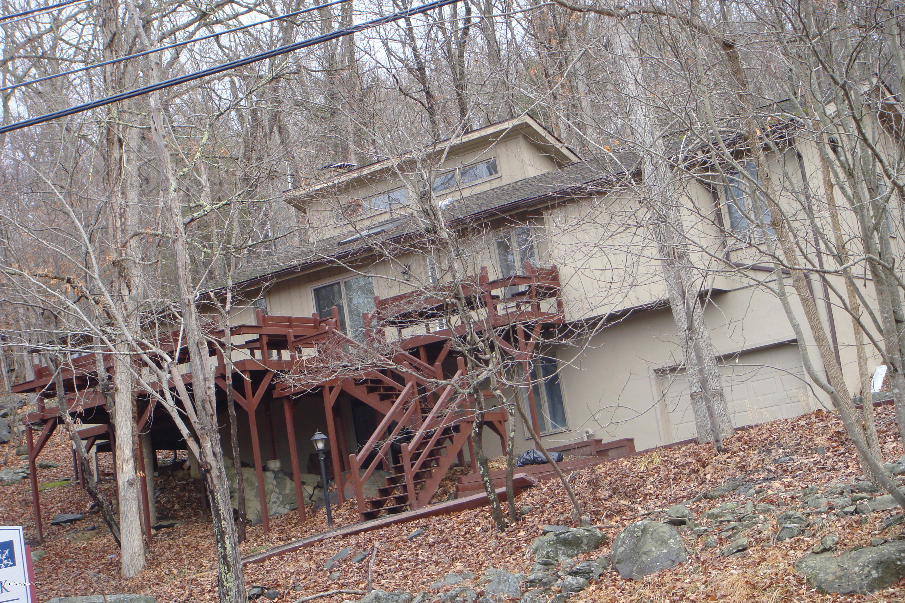 6375 Decker Road Bushkill, PA 18324 - Photo 1 of 60 a view of a wooden chairs with iron fence