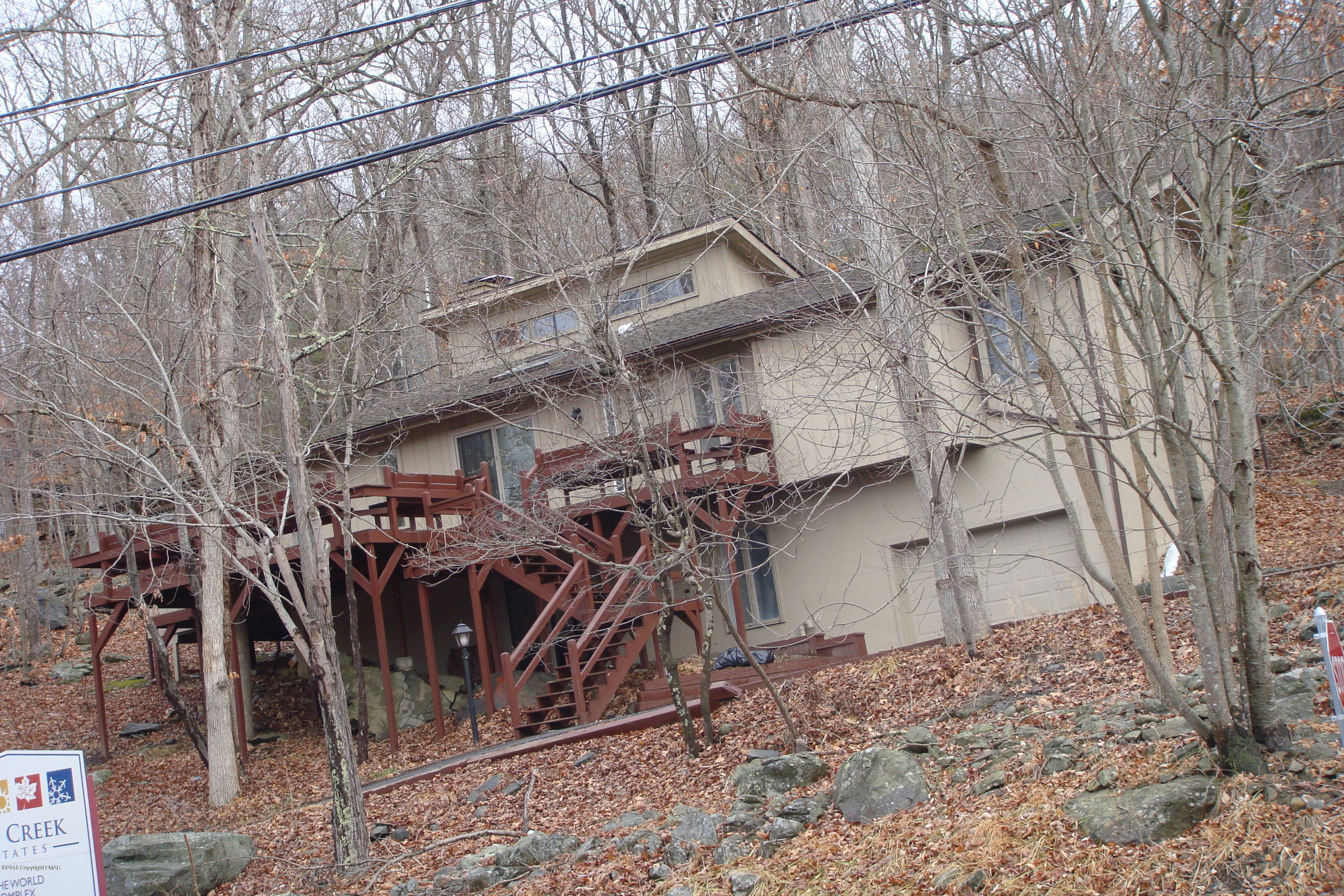 6375 Decker Road Bushkill, PA 18324 - Photo 2 of 60 a view of a backyard with plants and large trees