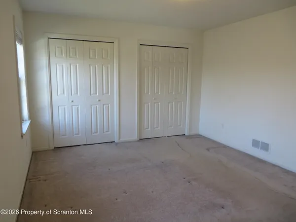 an empty room with mirror