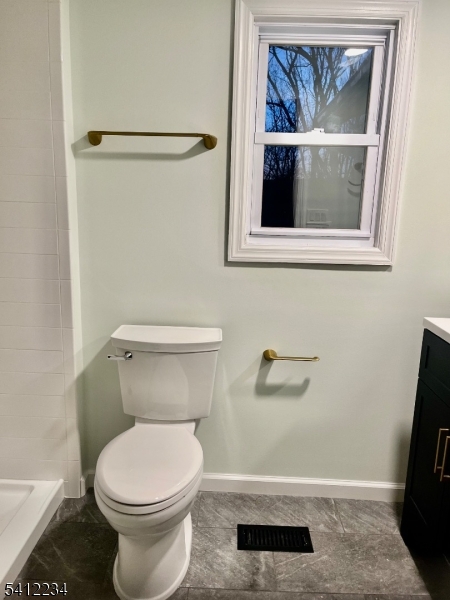 903 Green Pond Road Rockaway, NJ 07866 - Photo 12 of 13 a bathroom with a toilet and a vanity