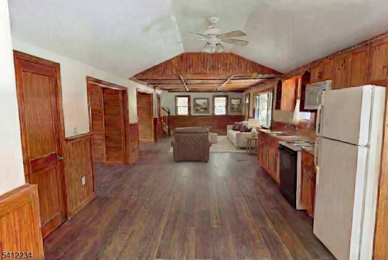 903 Green Pond Road Rockaway, NJ 07866 - Photo 7 of 13 a kitchen with stainless steel appliances granite countertop a refrigerator stove and wooden floors