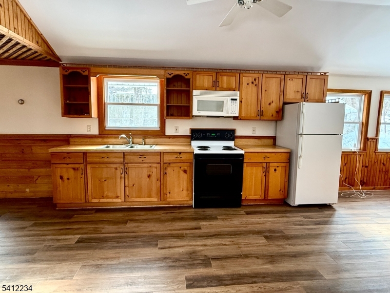 903 Green Pond Road Rockaway, NJ 07866 - Photo 8 of 13 a view of a kitchen with a sink appliances and a window
