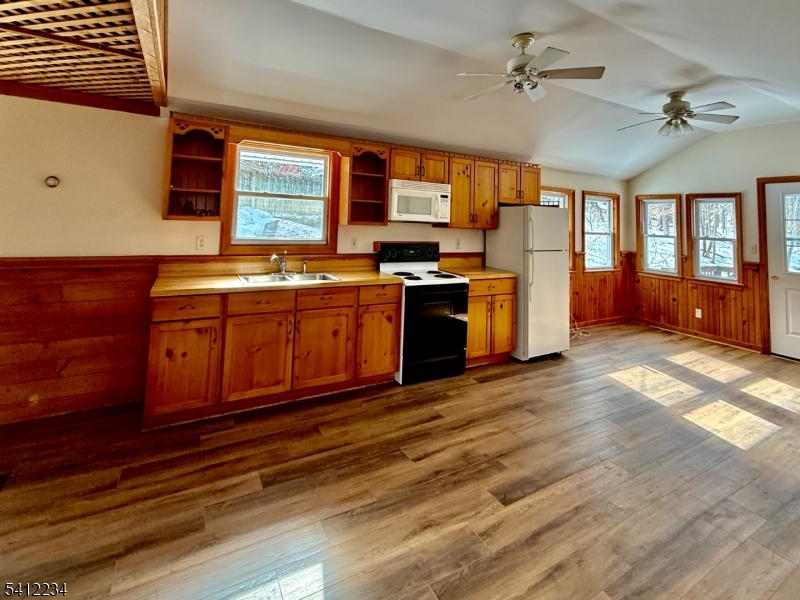 903 Green Pond Road Rockaway, NJ 07866 - Photo 9 of 13 a kitchen with stainless steel appliances granite countertop a sink stove and refrigerator
