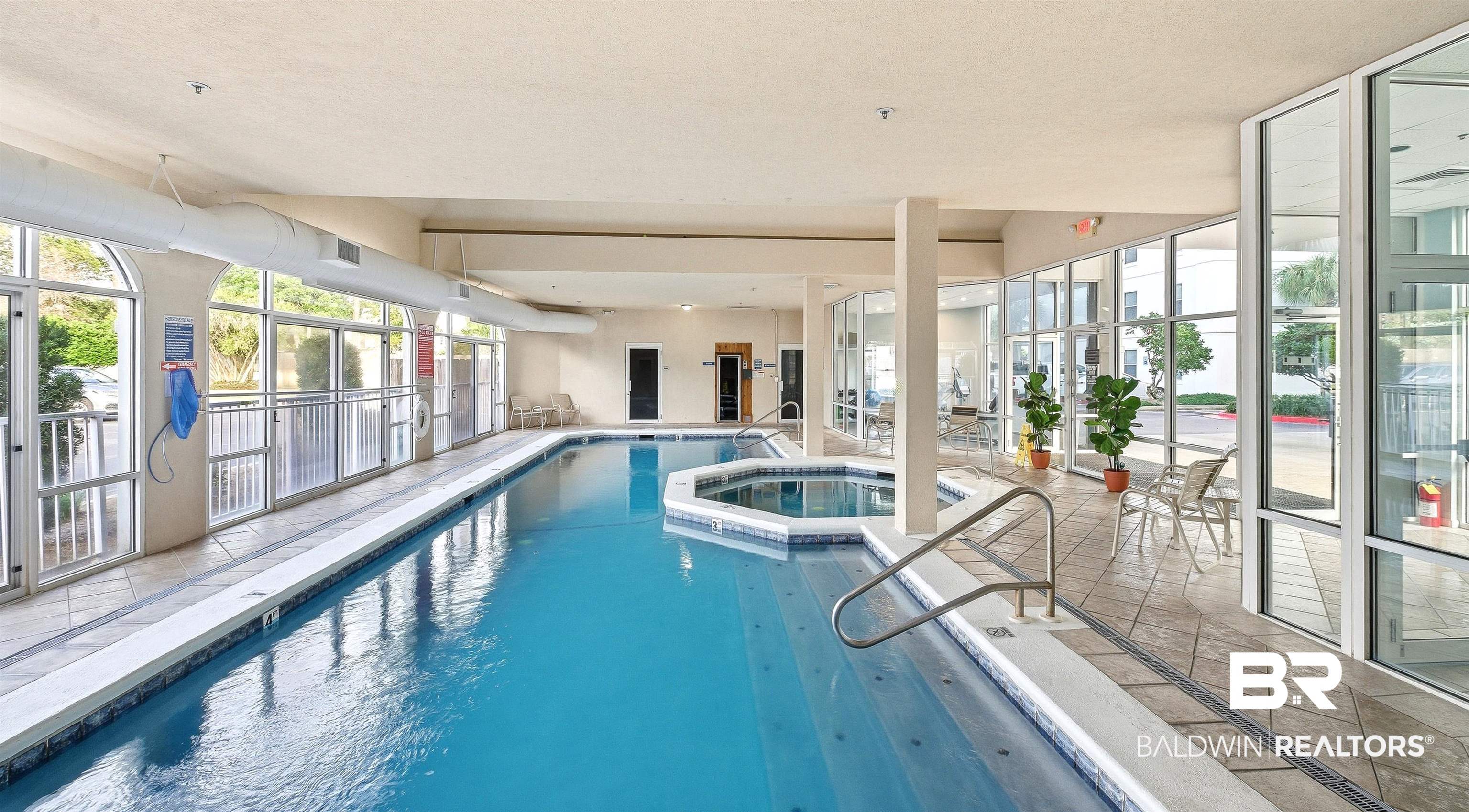 27282 Canal Road, Unit 408 Orange Beach, AL 36561 - Photo 29 of 37 Indoor swimming pool featuring a connected hot tub