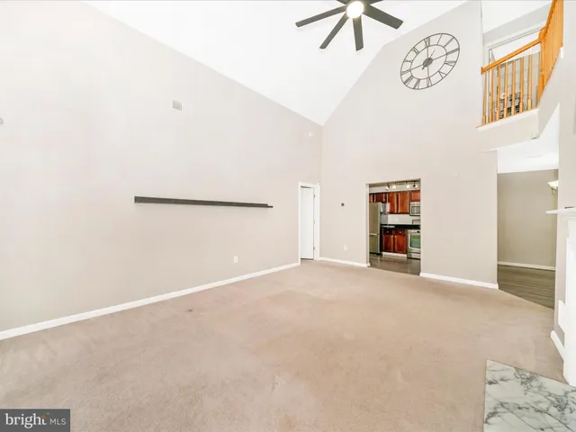 a view of a livingroom with an empty space and a fireplace