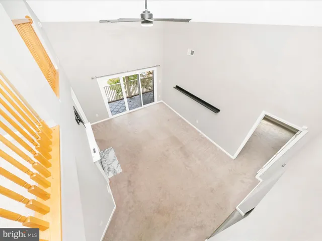 a kitchen with stainless steel appliances granite countertop a refrigerator a stove a sink and a microwave