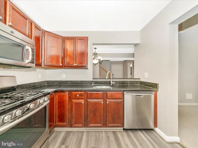 a view of a livingroom with a ceiling fan and window