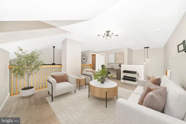a living room with furniture potted plant and a chandelier