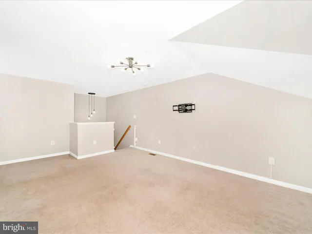 wooden floor in a hall with a window