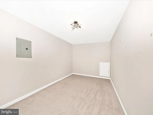 a view of a balcony with wooden floor & fence