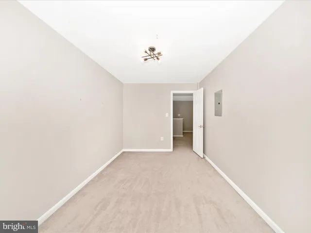 a view of a porch with a floor to ceiling window next to a yard