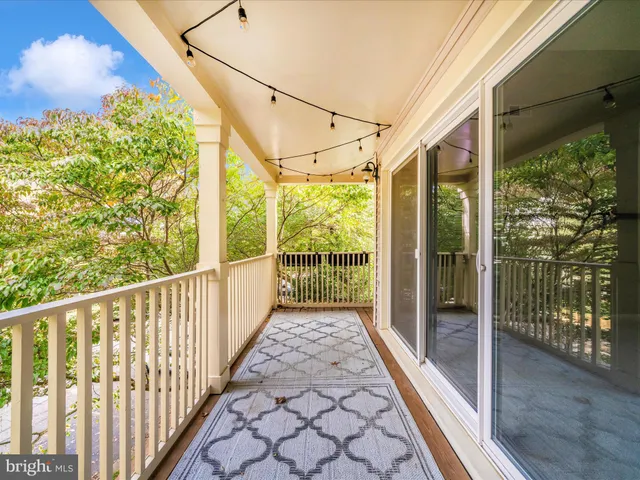 a front view of a house with many windows