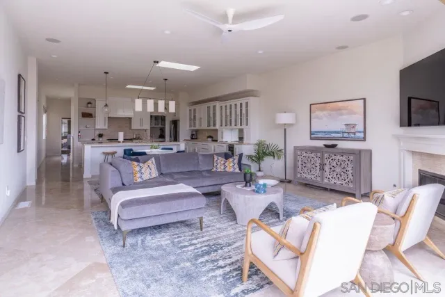 a kitchen with a sink dishwasher a stove and a microwave oven with cabinets