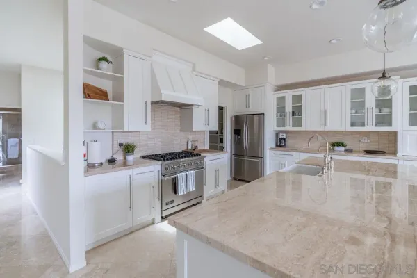 a spacious bedroom with a bed and a window