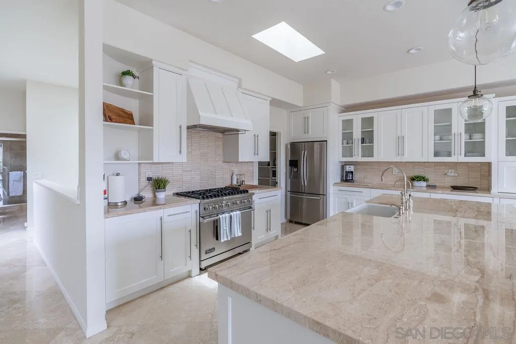 2508 Manchester Avenue Cardiff, CA 92007 - Photo 18 of 75 a kitchen with stainless steel appliances granite countertop a sink and cabinets