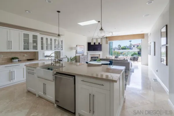 a large bed sitting in a bedroom next to a window