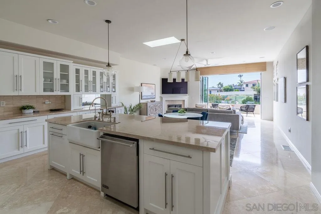 2508 Manchester Avenue Cardiff, CA 92007 - Photo 20 of 75 a kitchen with center island and stainless steel appliances