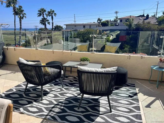 a view of a chairs and table in the patio