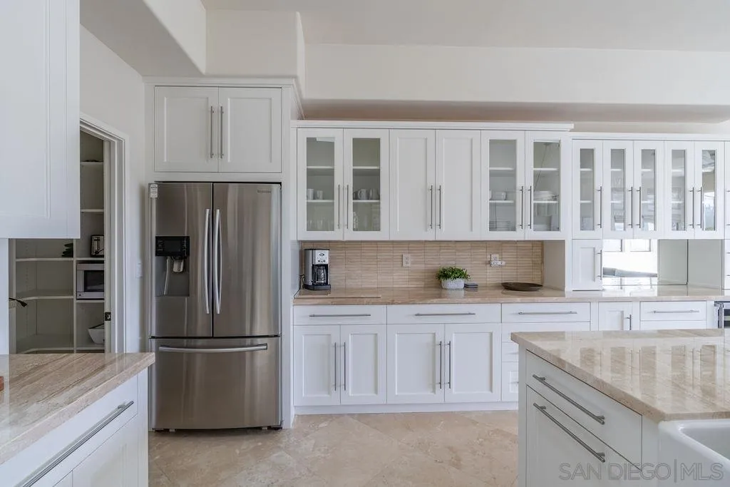 2508 Manchester Avenue Cardiff, CA 92007 - Photo 21 of 75 a kitchen with granite countertop a refrigerator and a sink