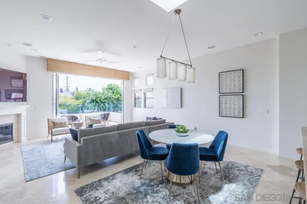 a bathroom with a granite countertop sink toilet a large mirror and shower