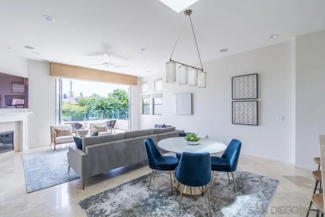 a bathroom with a granite countertop sink toilet a large mirror and shower