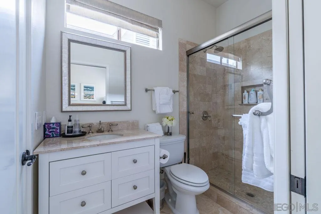 2508 Manchester Avenue Cardiff, CA 92007 - Photo 35 of 75 a bathroom with a granite countertop sink toilet and shower