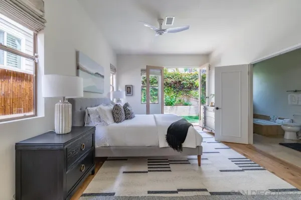 a kitchen with a sink a stove top oven and cabinets