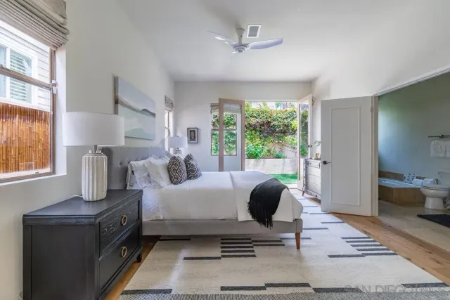 a kitchen with a sink a stove top oven and cabinets