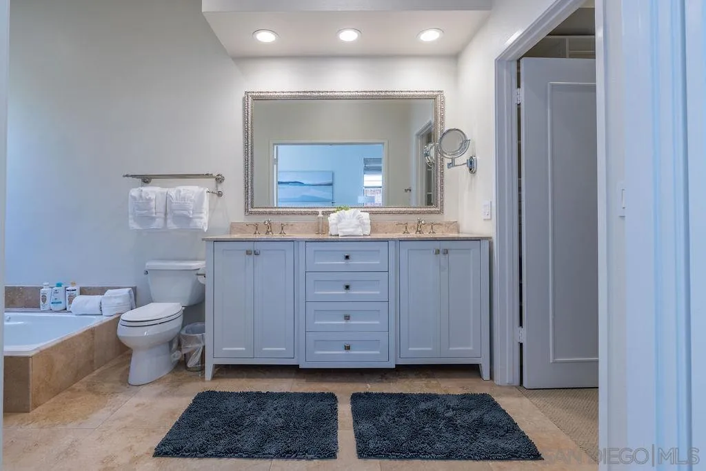 2508 Manchester Avenue Cardiff, CA 92007 - Photo 49 of 75 a view of bathroom with a toilet a sink and mirror