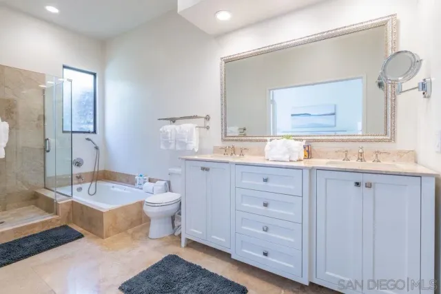 a living room with furniture a flat screen tv and a window