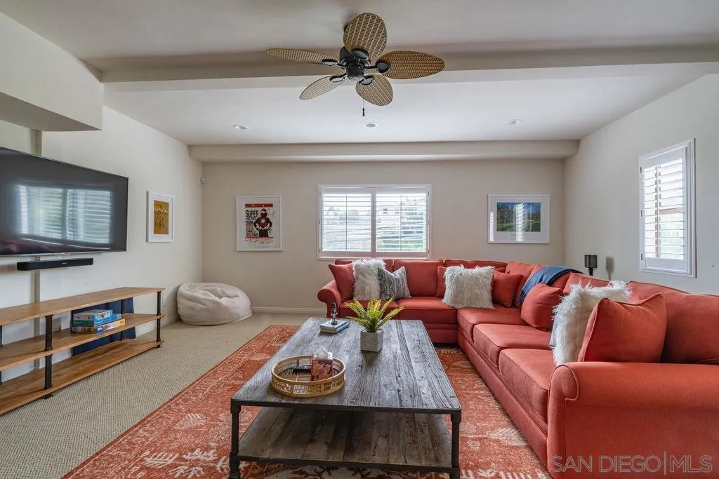 2508 Manchester Avenue Cardiff, CA 92007 - Photo 74 of 75 a living room with furniture a flat screen tv and a window