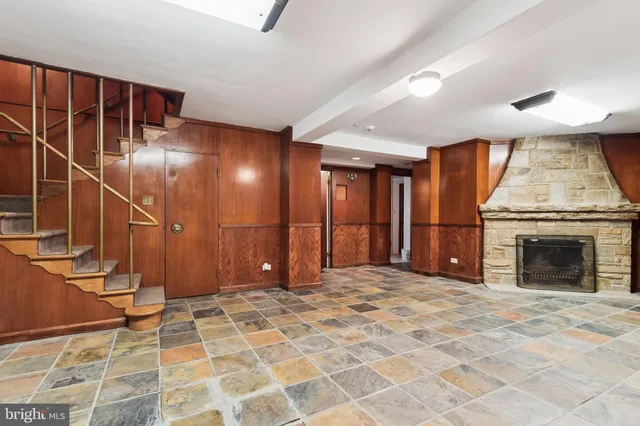 a view of an empty room with a fireplace