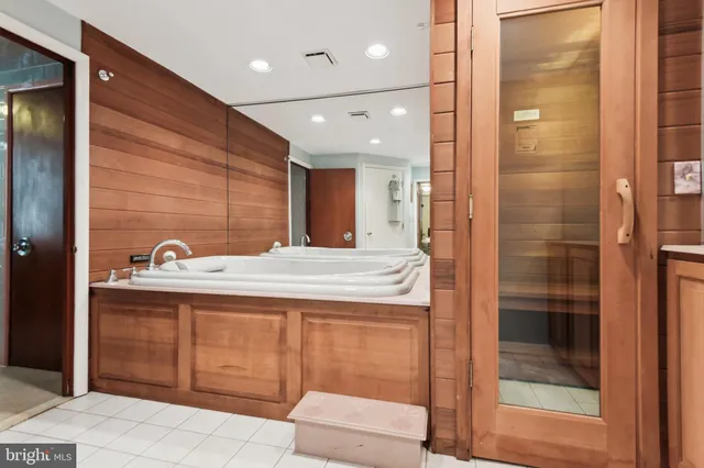 a bathroom with a bathtub and a sink