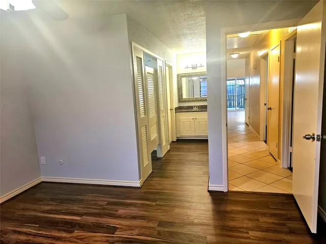 a view of a kitchen from the hallway
