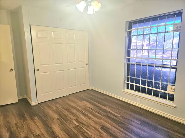 a view of wooden floor and chandelier in a room