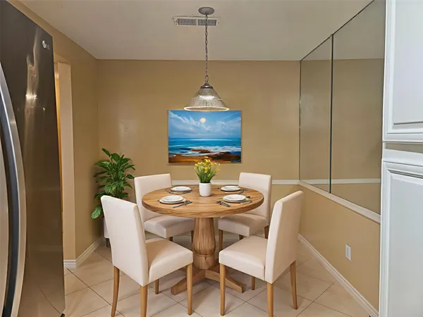 a dining room with furniture and window