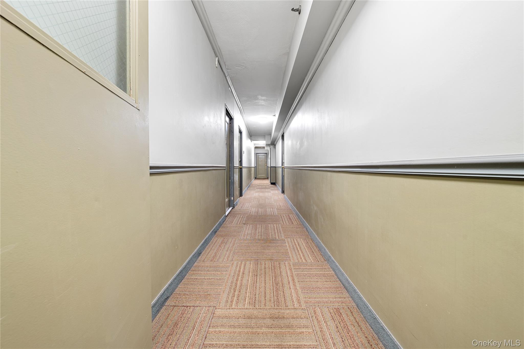 99-32 66th Road, Unit 5K Queens, NY 11374 - Photo 17 of 20 Corridor with carpet flooring