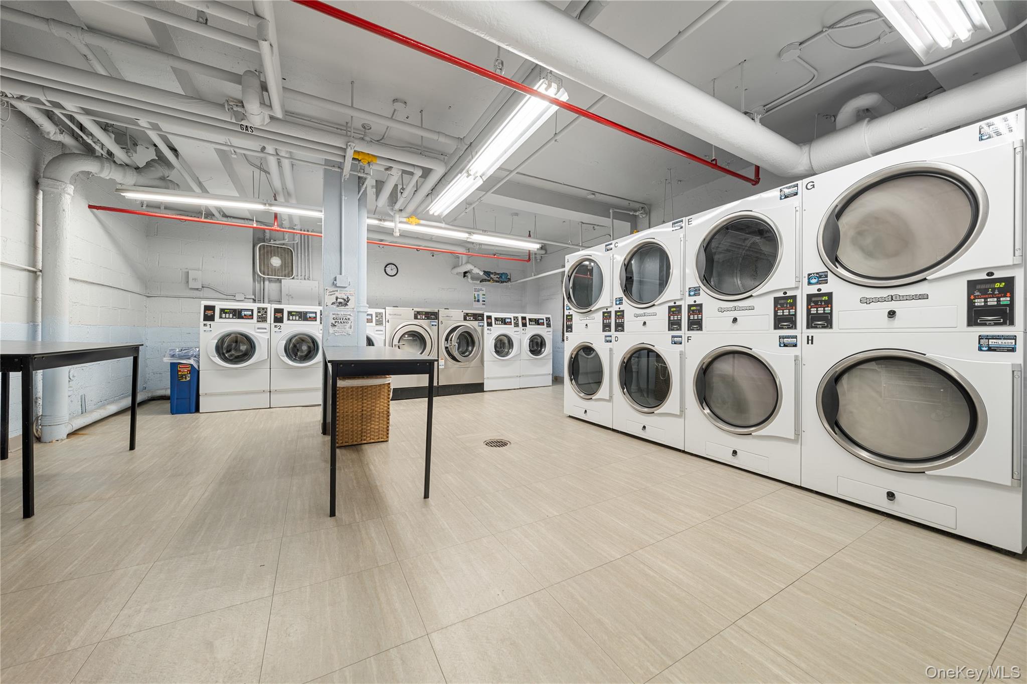 99-32 66th Road, Unit 5K Queens, NY 11374 - Photo 5 of 20 Community laundry room with washing machine and dryer