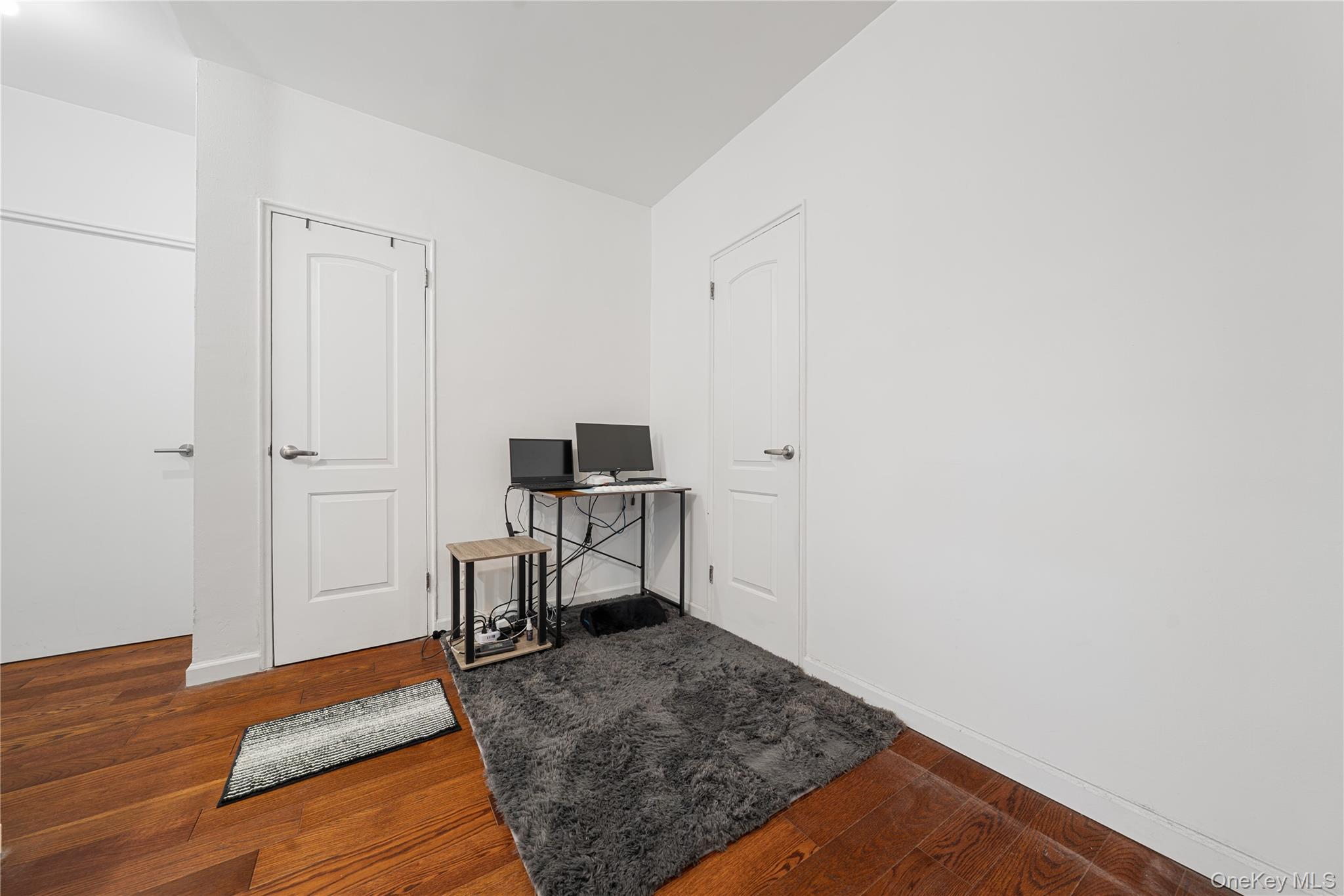 99-32 66th Road, Unit 5K Queens, NY 11374 - Photo 10 of 20 Office area featuring dark wood-style floors