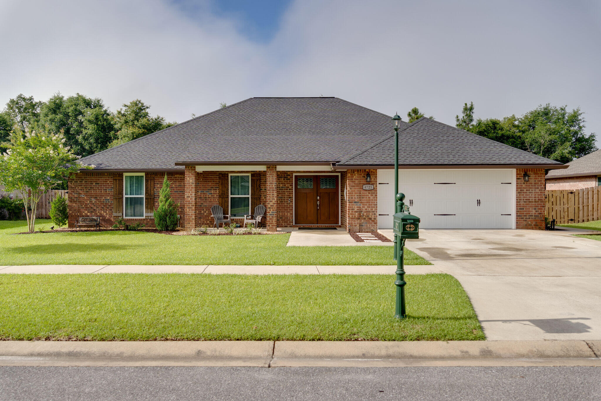 4723 Chanson Crossing Crestview, FL 32539 - Photo 1 of 58 a front view of a house with a yard