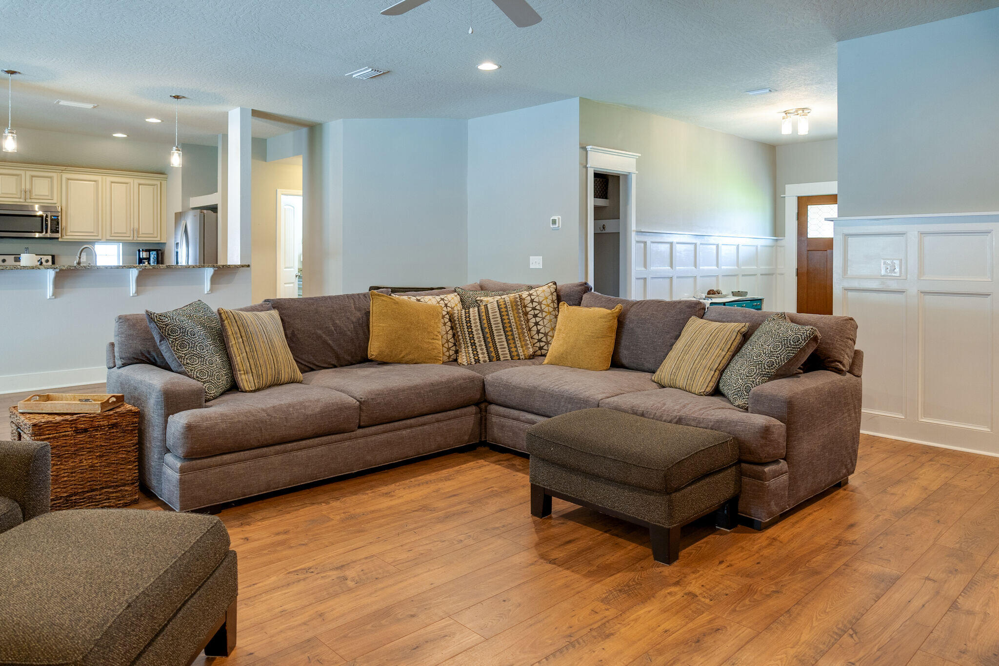 4723 Chanson Crossing Crestview, FL 32539 - Photo 11 of 58 a living room with furniture and kitchen view